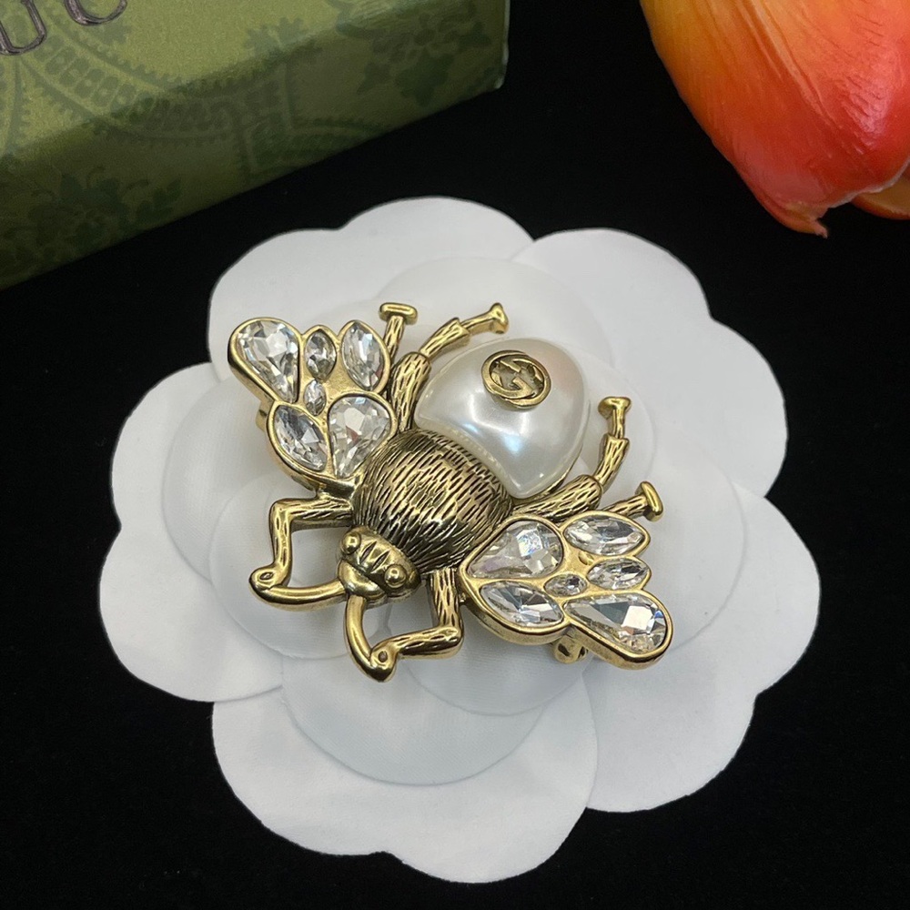 Gucci brooches
